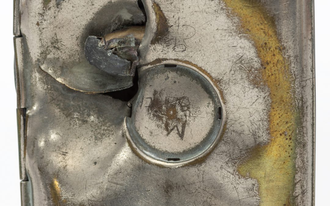 Cigarette Case with Damage from a Bullet